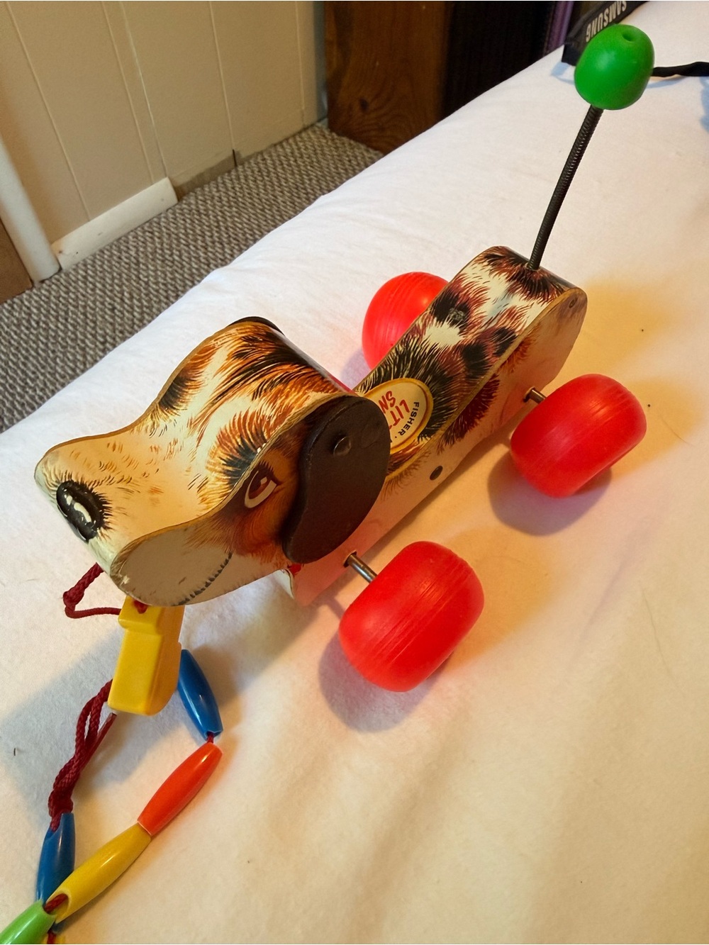 Vintage Wooden Pull-Along Dog Toy in Brown with Red Wheels 1968